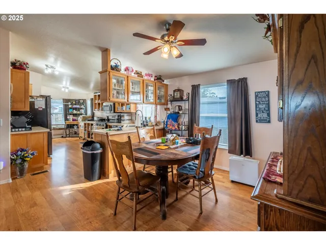 a dining room with furniture and a chandelier