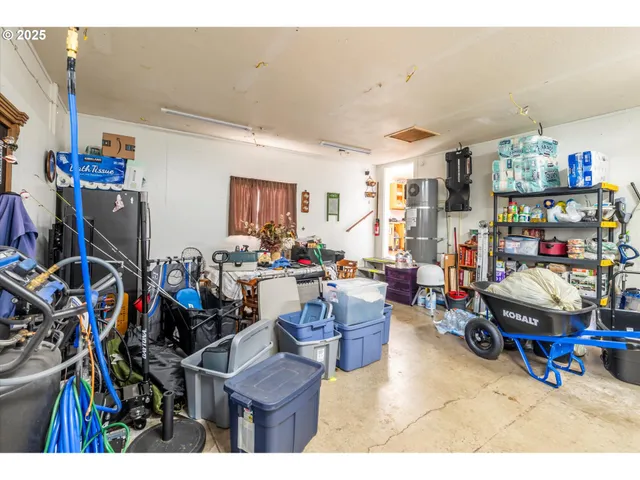 a living room filled with furniture and a gym