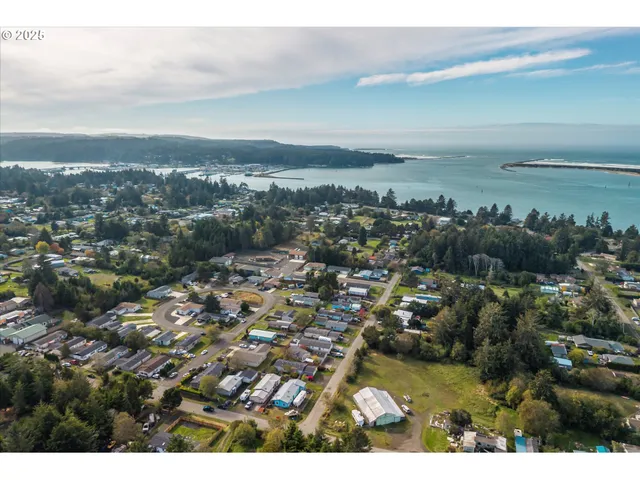 a aerial view of a house with swimming pool and a yard