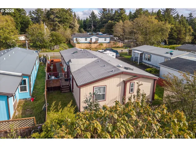 a aerial view of a house with a yard