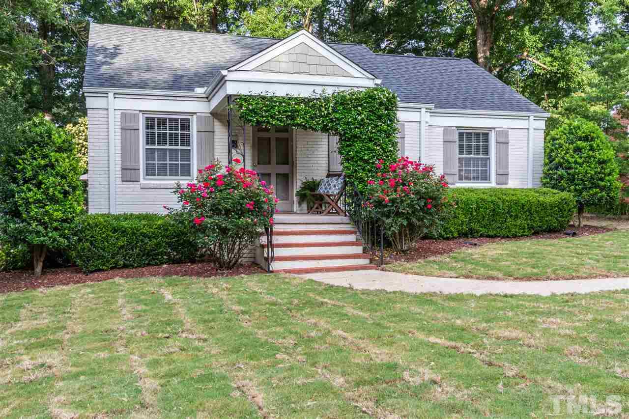 1230 Clifton Street Raleigh, NC 27604 - Photo 1 of 19 a front view of a house with a garden