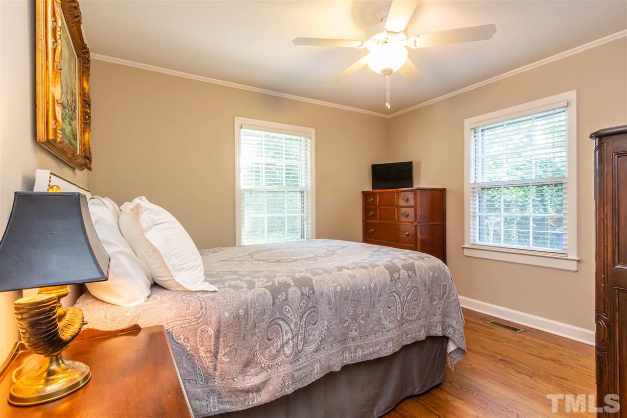 1230 Clifton Street Raleigh, NC 27604 - Photo 11 of 19 a bedroom with a bed and a window