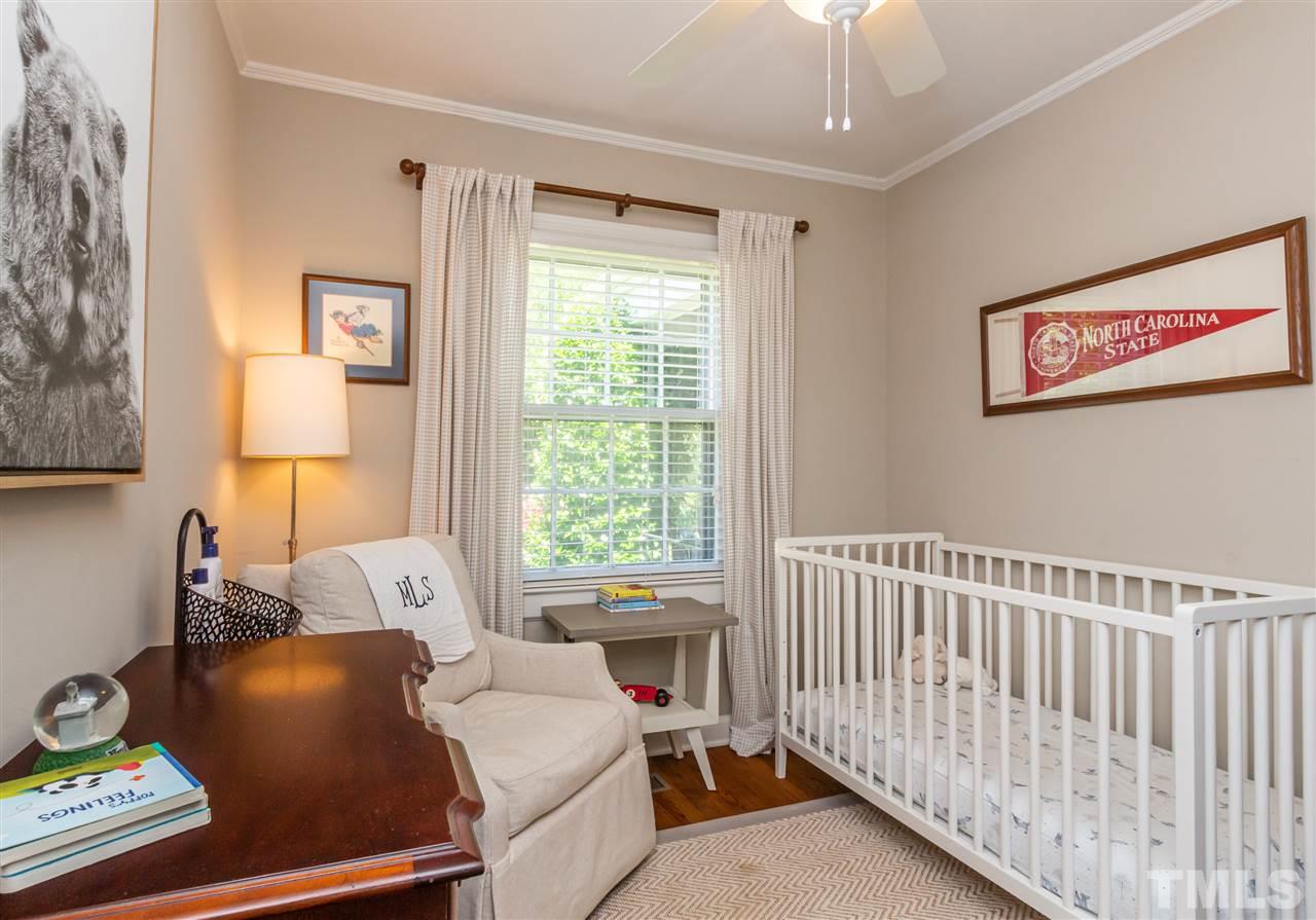 1230 Clifton Street Raleigh, NC 27604 - Photo 12 of 19 a bed room with a bed and a window