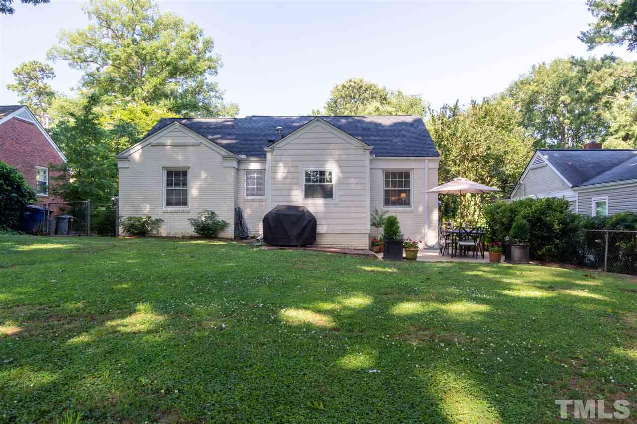 1230 Clifton Street Raleigh, NC 27604 - Photo 16 of 19 a view of a house with a yard and a garden