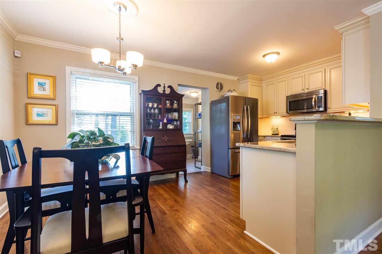 1230 Clifton Street Raleigh, NC 27604 - Photo 7 of 19 a view of a dining room with furniture window and wooden floor