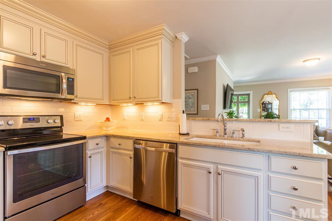 1230 Clifton Street Raleigh, NC 27604 - Photo 8 of 19 a kitchen with granite countertop cabinets stainless steel appliances and a sink