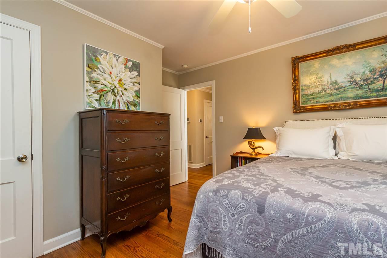 1230 Clifton Street Raleigh, NC 27604 - Photo 10 of 19 a bedroom with a bed and painting on the wall
