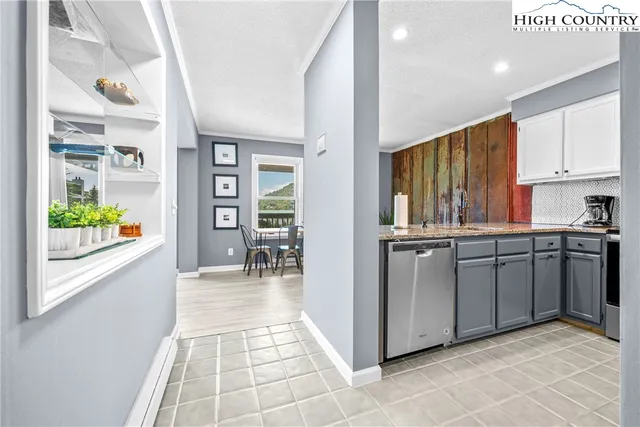 a kitchen with sink cabinets and outdoor space