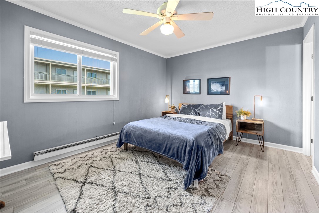 301 Pinnacle Inn Road, Unit 3207 Beech Mountain, NC 28604 - Photo 15 of 37 a spacious bedroom with a bed and a window