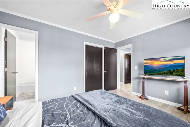 a bedroom with furniture and a chandelier