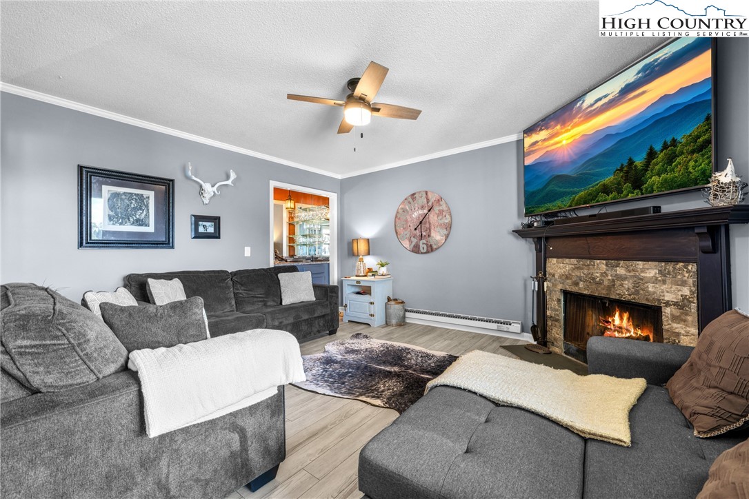 301 Pinnacle Inn Road, Unit 3207 Beech Mountain, NC 28604 - Photo 3 of 37 a living room with furniture and a fireplace