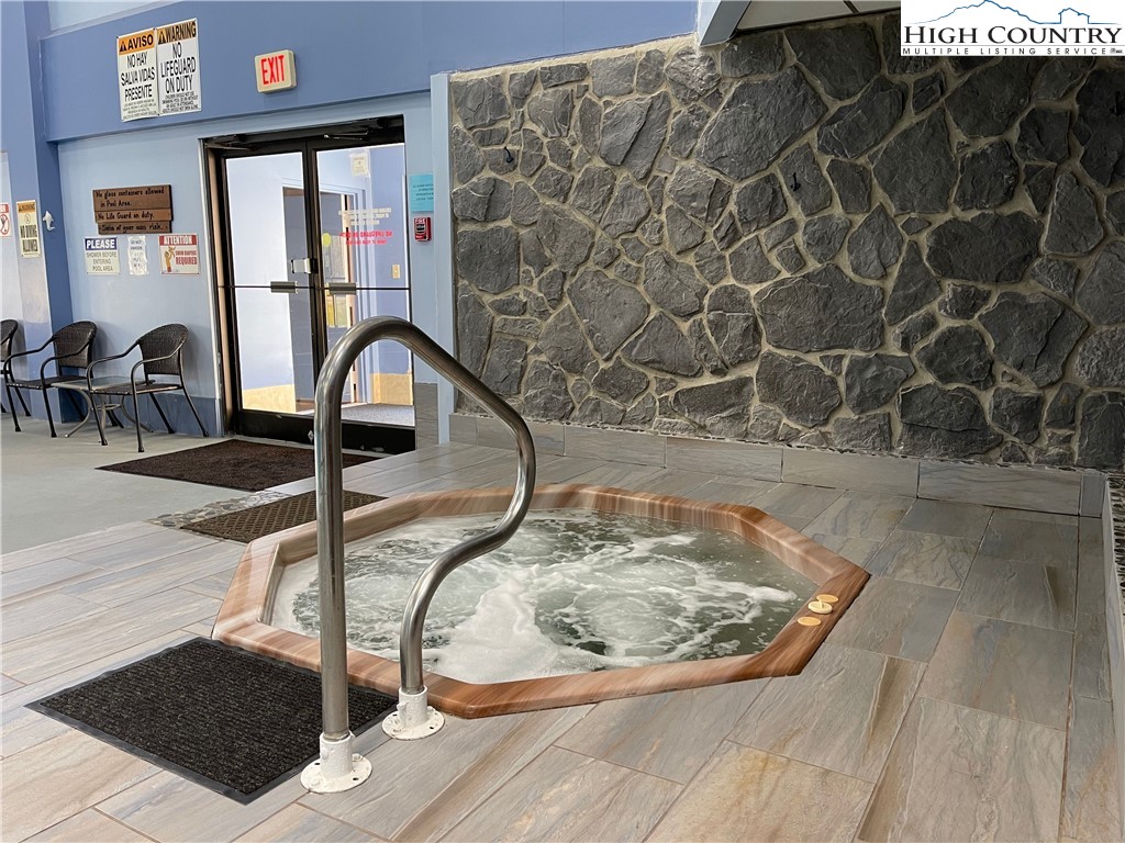 301 Pinnacle Inn Road, Unit 3207 Beech Mountain, NC 28604 - Photo 32 of 37 a room with a rug