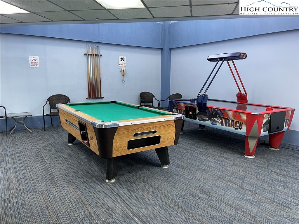 301 Pinnacle Inn Road, Unit 3207 Beech Mountain, NC 28604 - Photo 34 of 37 a room with pool table and windows
