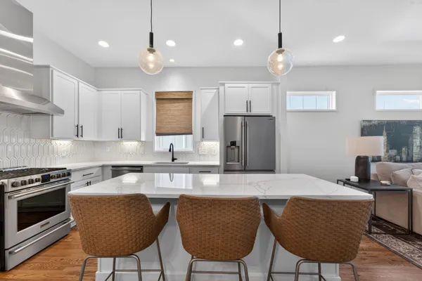 a stove top oven sitting inside of a kitchen
