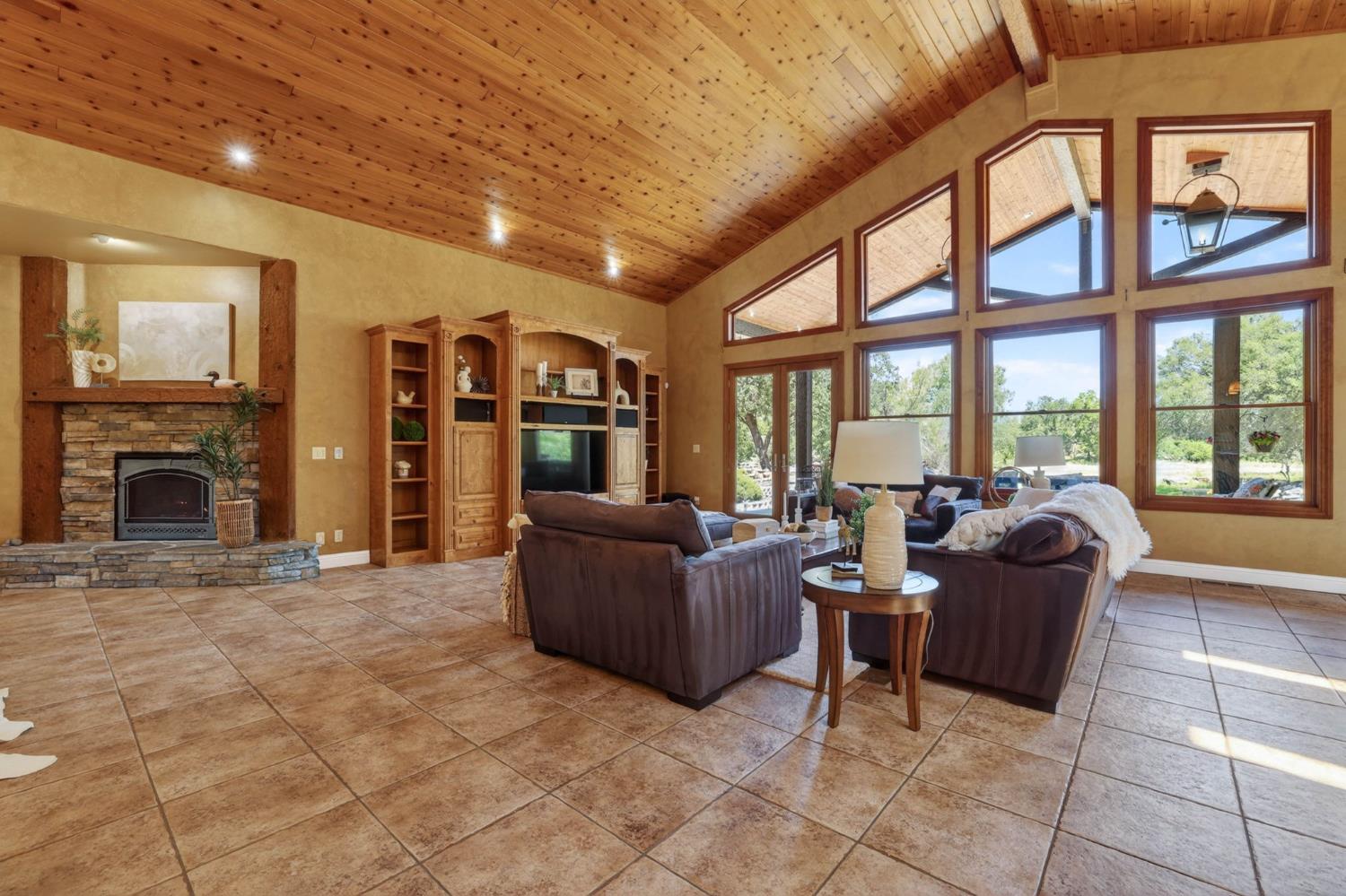 7021 Horseshoe Bar Road Loomis, CA 95650 - Photo 8 of 77 a living room with furniture and a fireplace