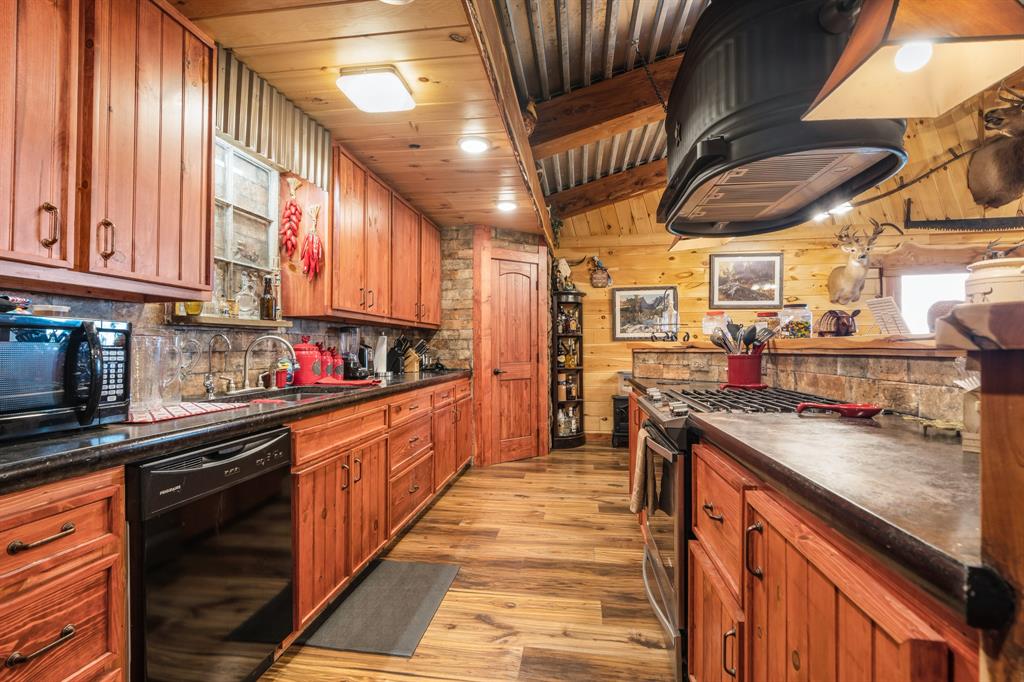 Tbd Fcr 920 Mexia, TX 76667 - Photo 24 of 34 a kitchen with stainless steel appliances granite countertop a sink a stove and cabinets