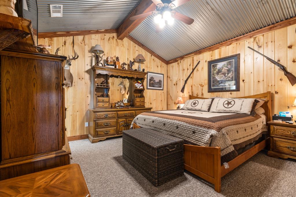Tbd Fcr 920 Mexia, TX 76667 - Photo 26 of 34 a spacious bedroom with a bed and wooden cabinets