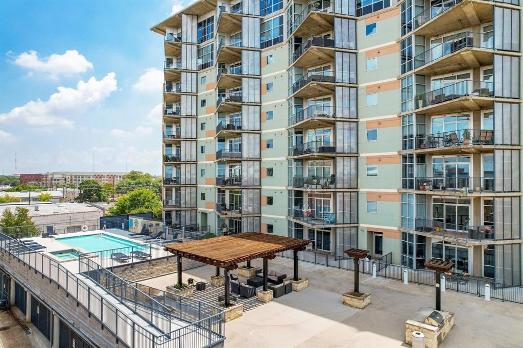 1001 Belleview Street, Unit 104 Dallas, TX 75215 - Photo 19 of 22 a roof deck with glass top table and chairs