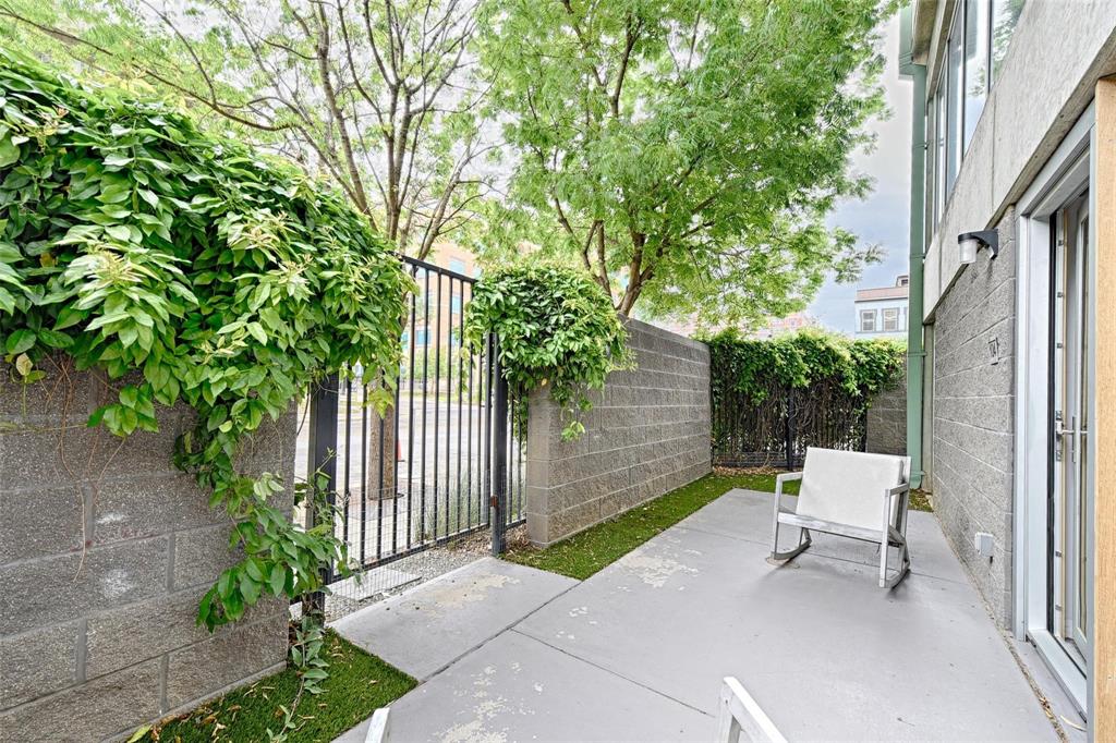 1001 Belleview Street, Unit 104 Dallas, TX 75215 - Photo 4 of 22 a view of a bench in the backyard with large tree