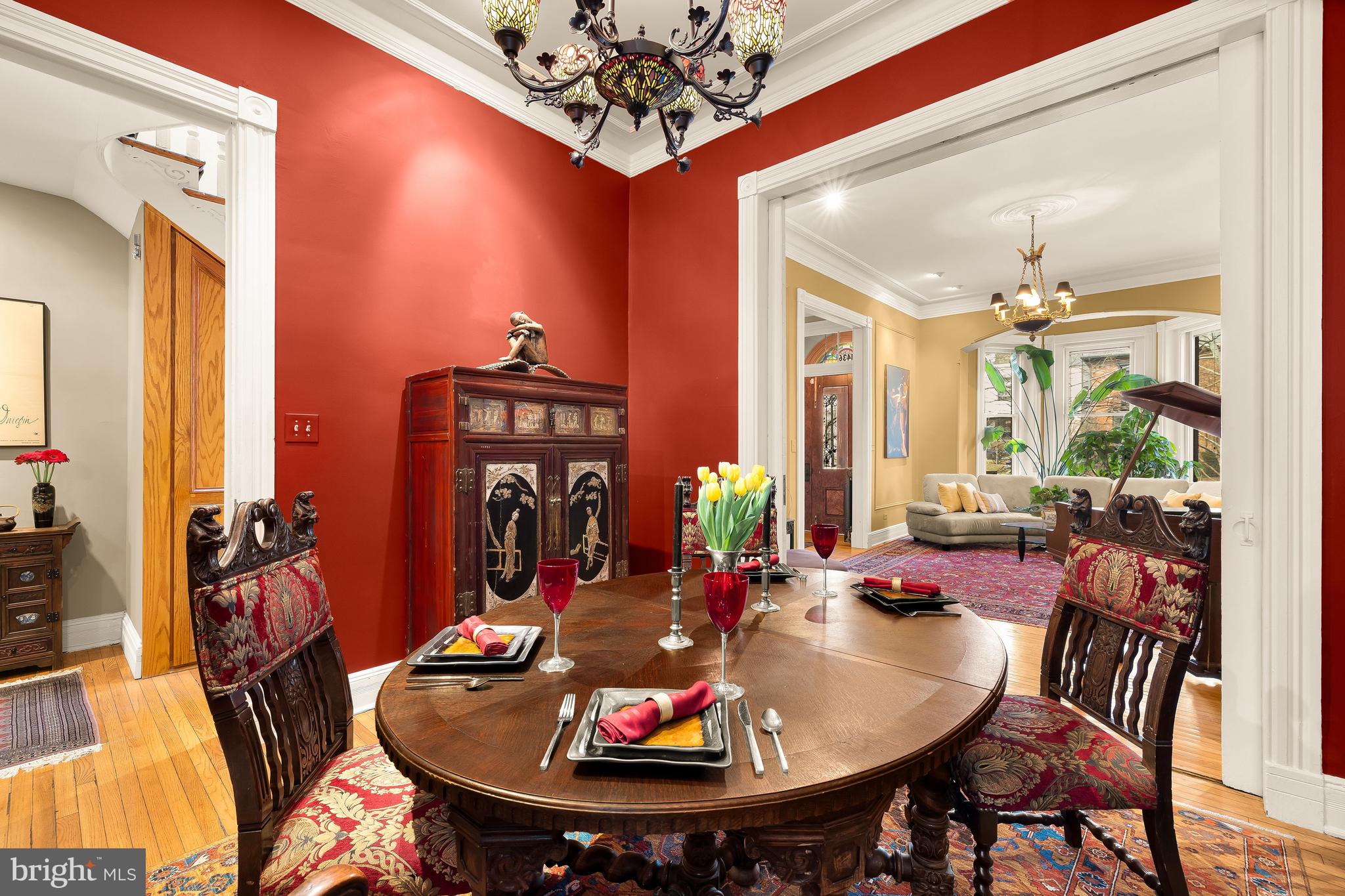 1436 Q Street Northwest Washington, DC 20009 - Photo 13 of 45 a view of a dining room with furniture and chandelier