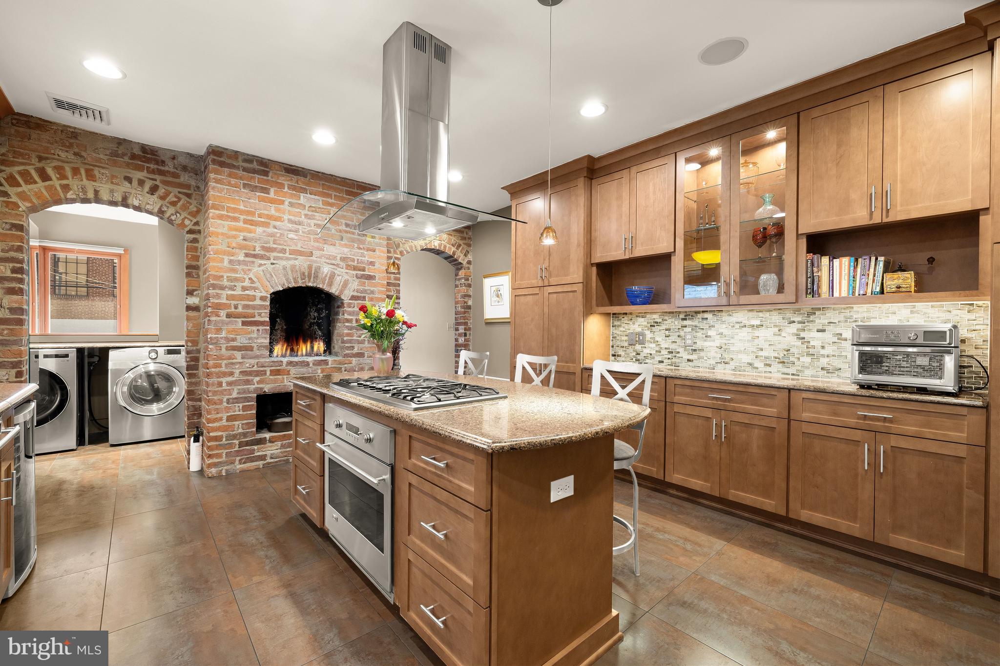 1436 Q Street Northwest Washington, DC 20009 - Photo 15 of 45 a kitchen with stainless steel appliances granite countertop a stove and a sink