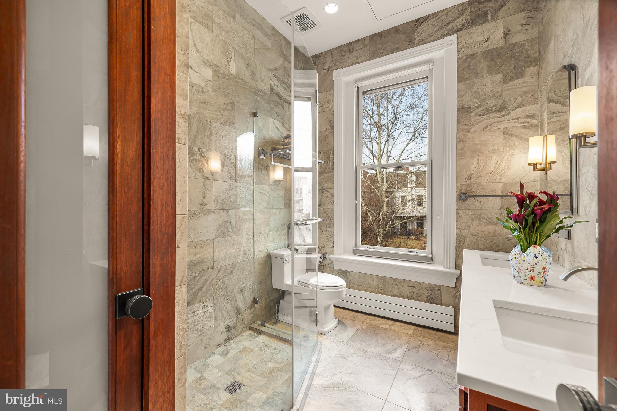 1436 Q Street Northwest Washington, DC 20009 - Photo 23 of 45 a bathroom with a bathtub and shower