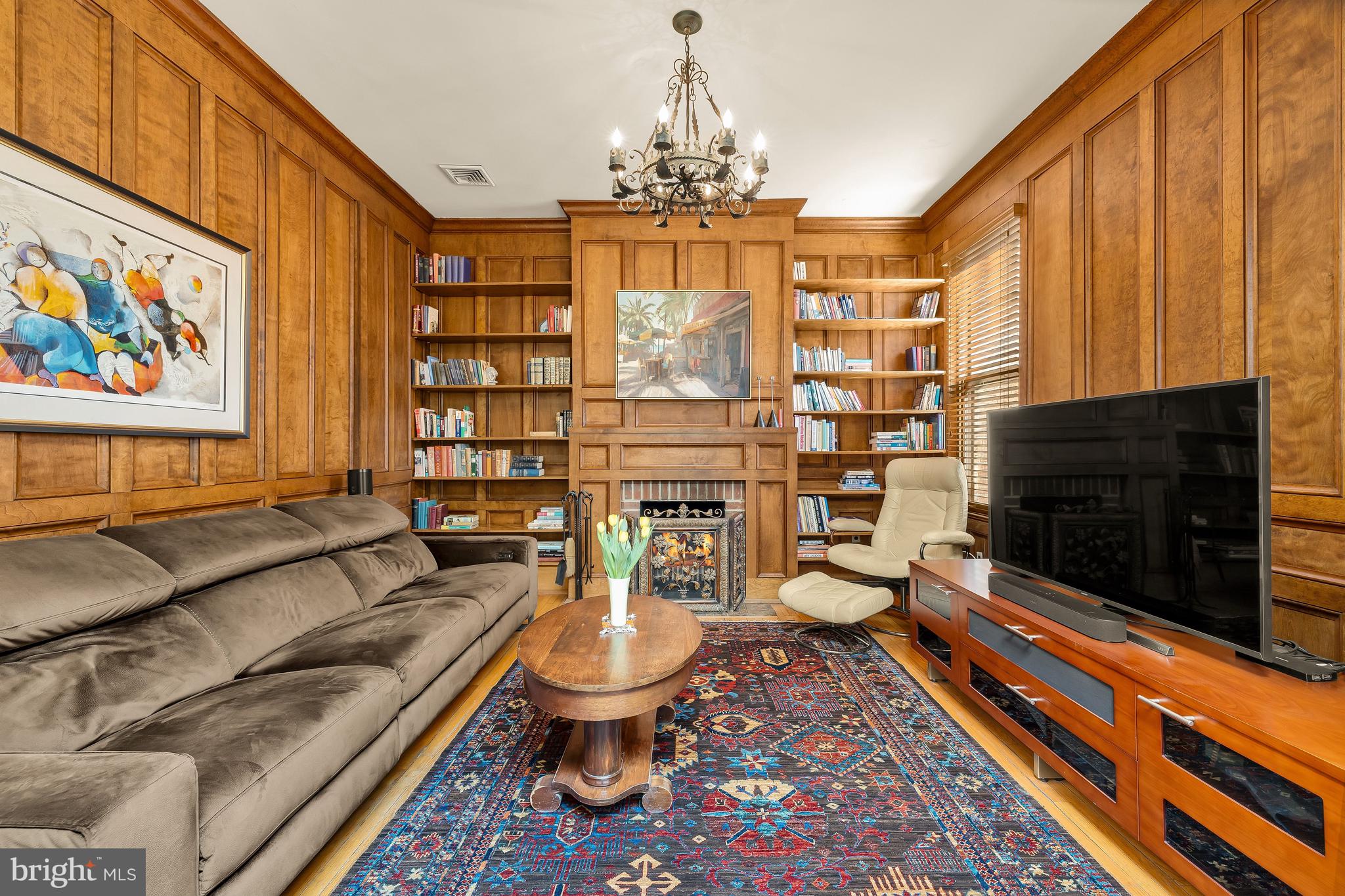 1436 Q Street Northwest Washington, DC 20009 - Photo 25 of 45 a living room with furniture a chandelier and a fireplace
