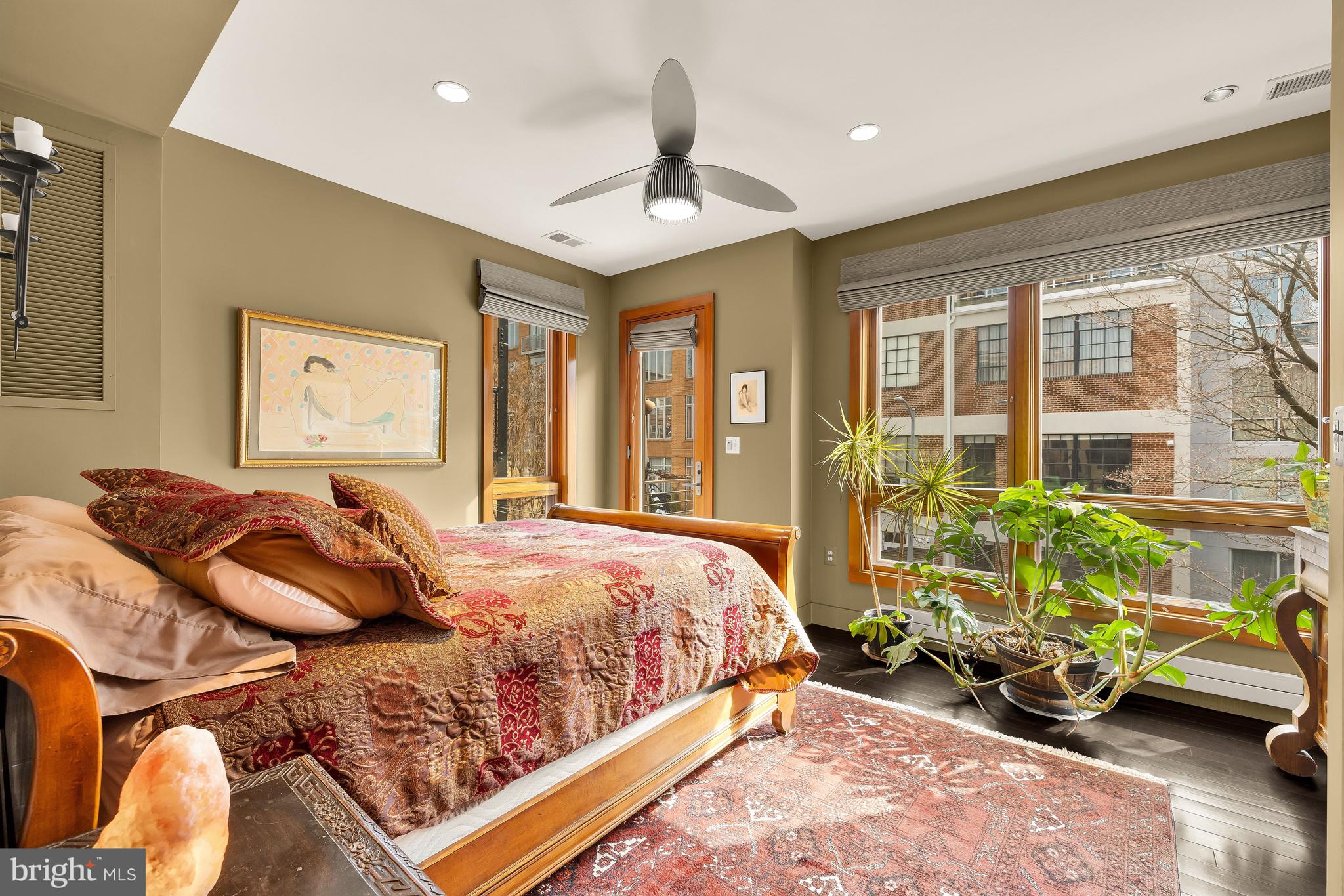 1436 Q Street Northwest Washington, DC 20009 - Photo 29 of 45 a bedroom with a bed and a chandelier