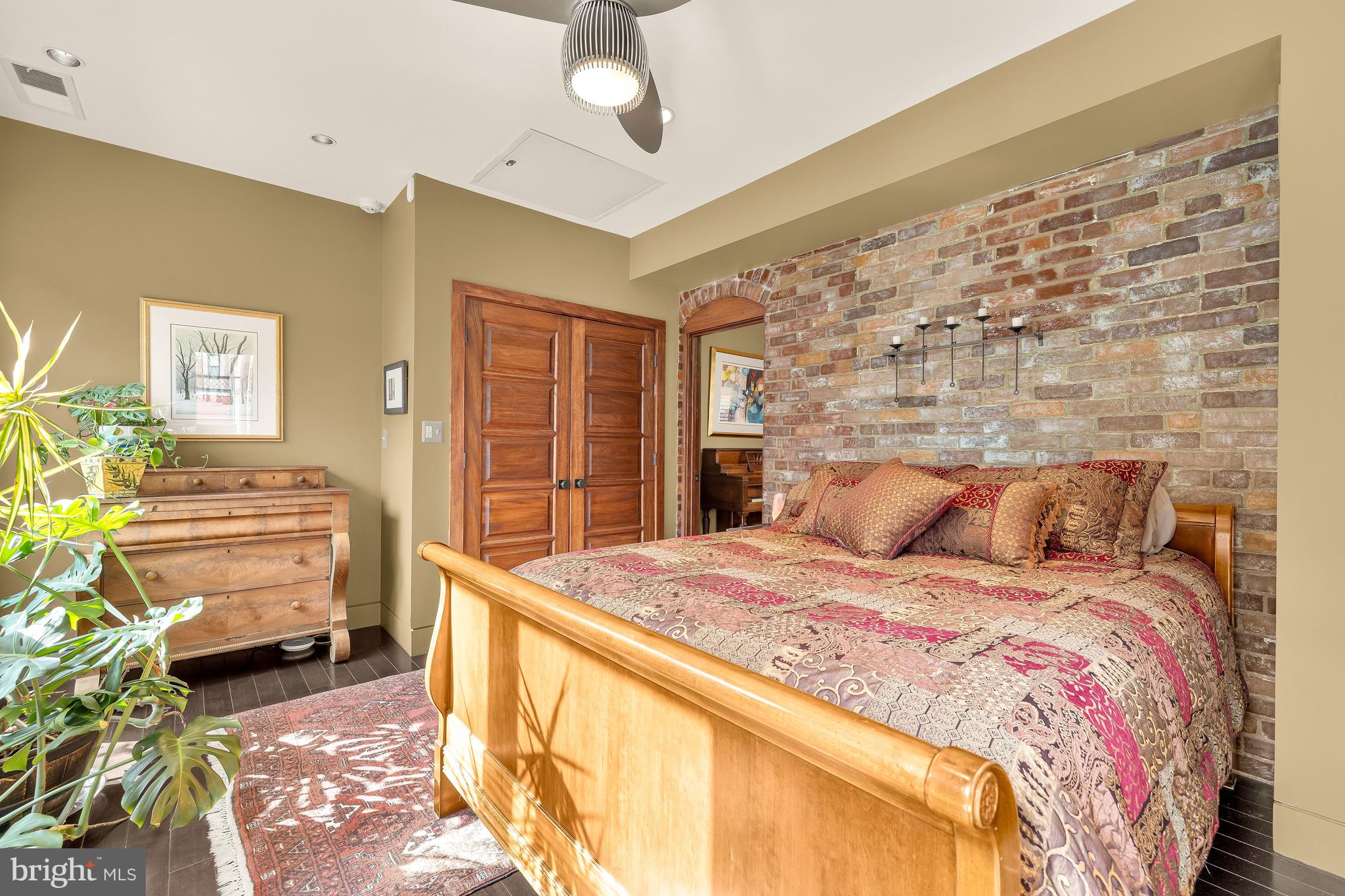 1436 Q Street Northwest Washington, DC 20009 - Photo 30 of 45 a bedroom with a bed and ceiling fan