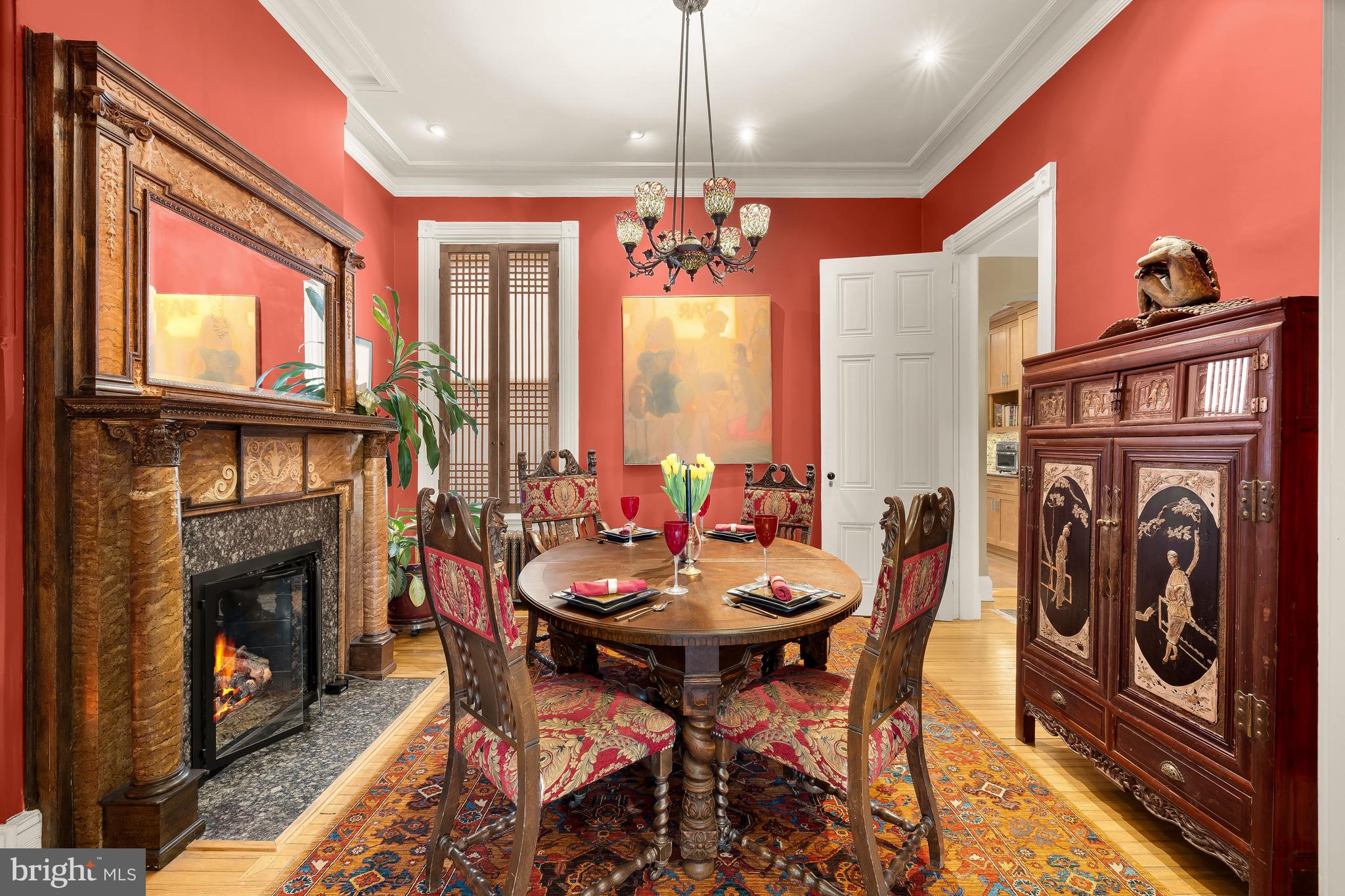 1436 Q Street Northwest Washington, DC 20009 - Photo 10 of 45 a view of a dining room with furniture window and fireplace