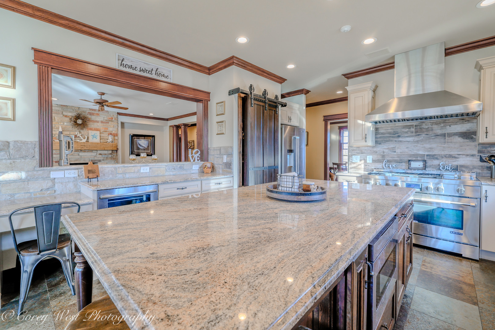 N004 Alexander Drive Geneva, IL 60134 - Photo 20 of 75 a kitchen with kitchen island granite countertop a stove and a sink