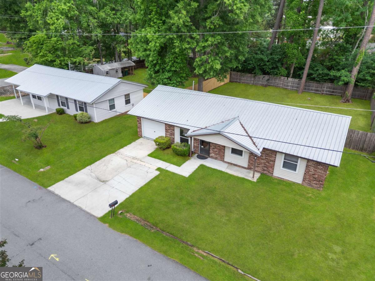 320 West Whatley Street Pooler, GA 31322 - Photo 2 of 34 an aerial view of a house with swimming pool garden view and trees