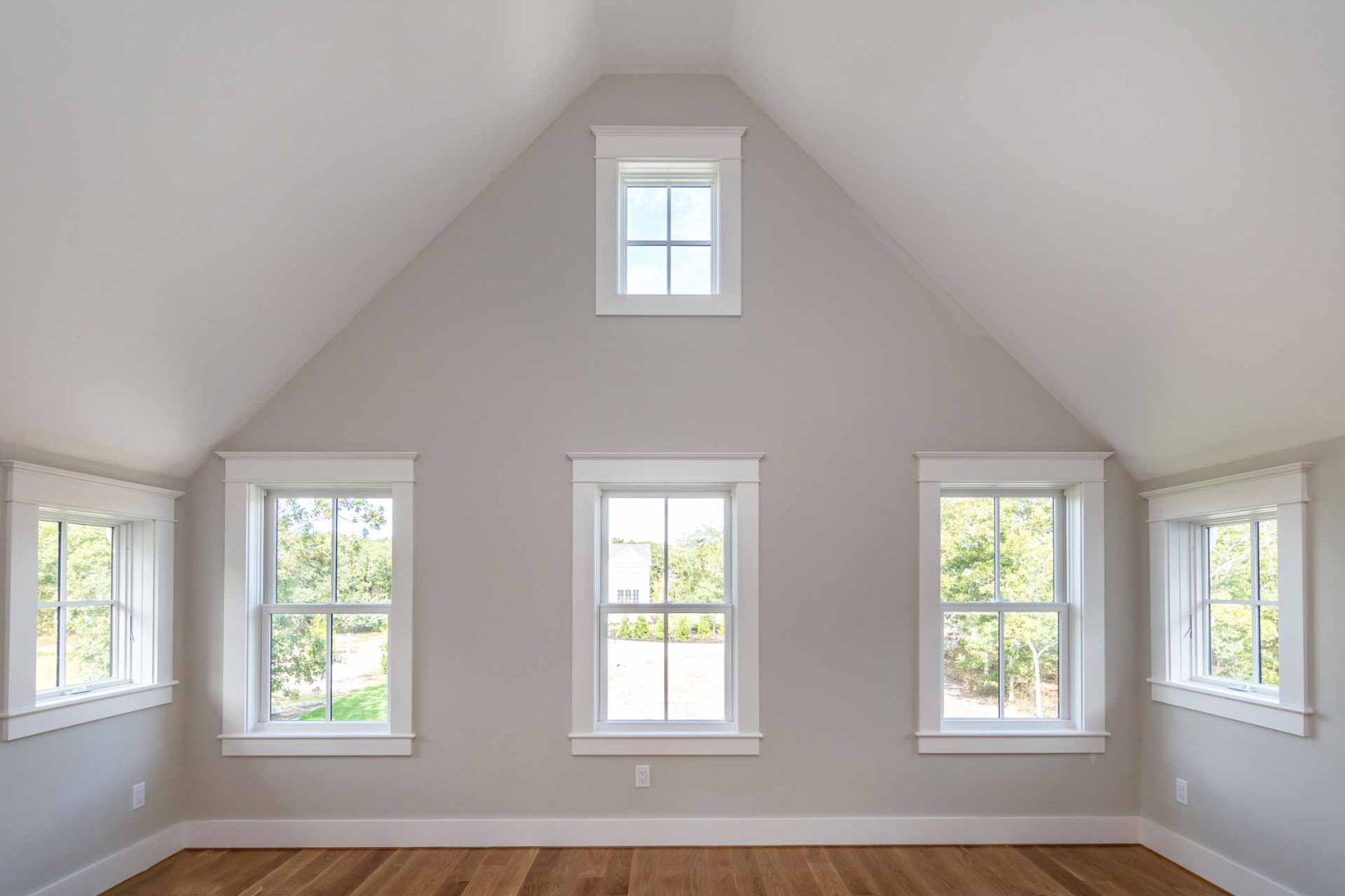 61 Division Road Edgartown, MA 02539 - Photo 12 of 20 a view of an empty room with wooden floor and windows