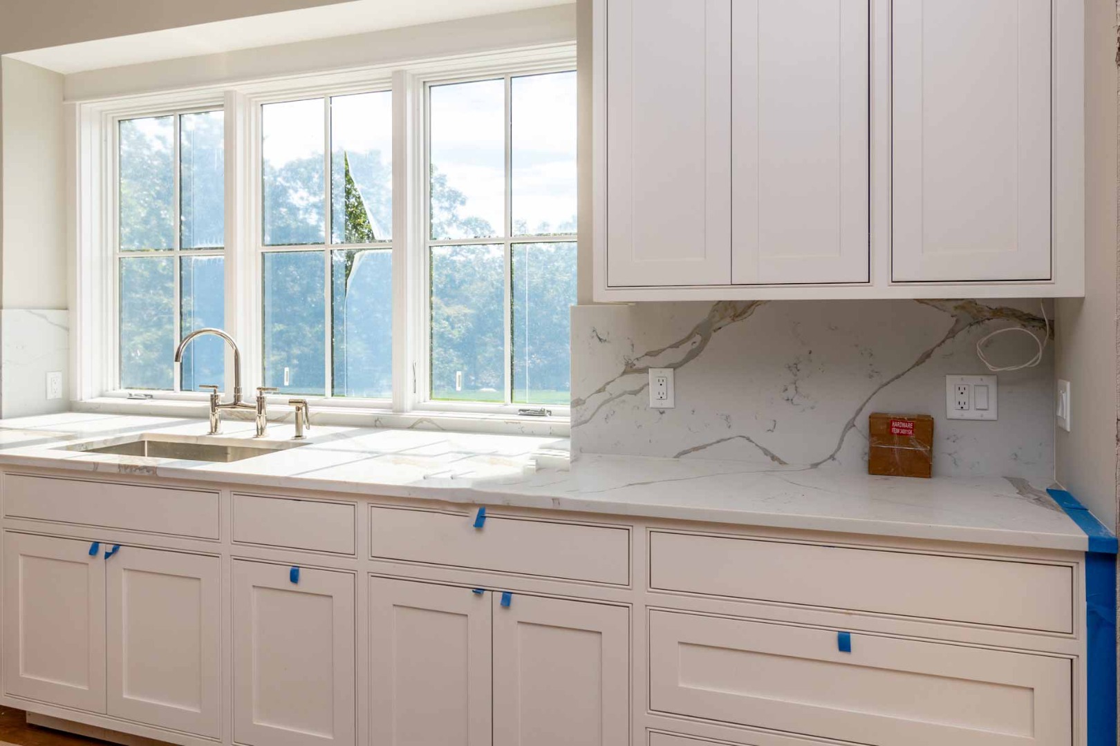 61 Division Road Edgartown, MA 02539 - Photo 3 of 20 a kitchen with a sink and cabinets