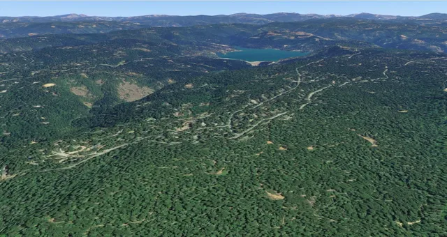 a view of an outdoor space with a mountain in the background