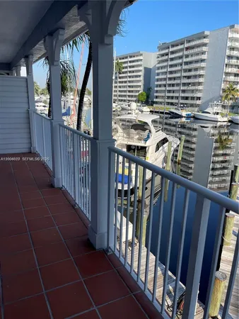 a view of balcony with furniture