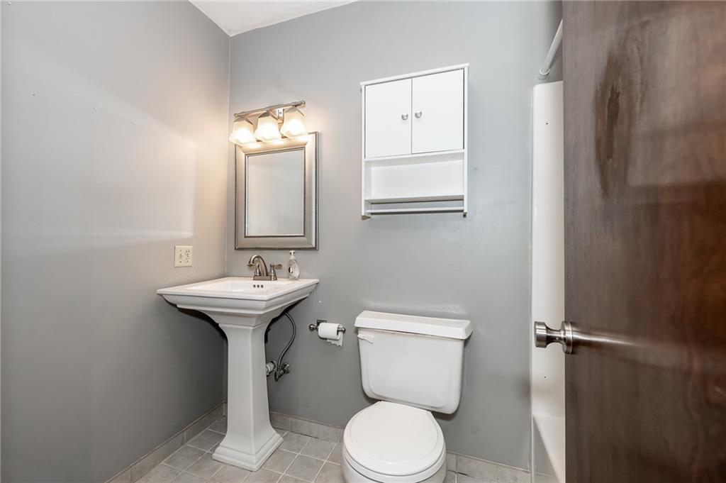 205 Briarwood Indiana, PA 15701 - Photo 18 of 23 a bathroom with a sink a toilet and mirror