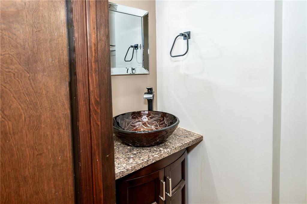 205 Briarwood Indiana, PA 15701 - Photo 6 of 23 a bathroom with a granite countertop sink and a mirror