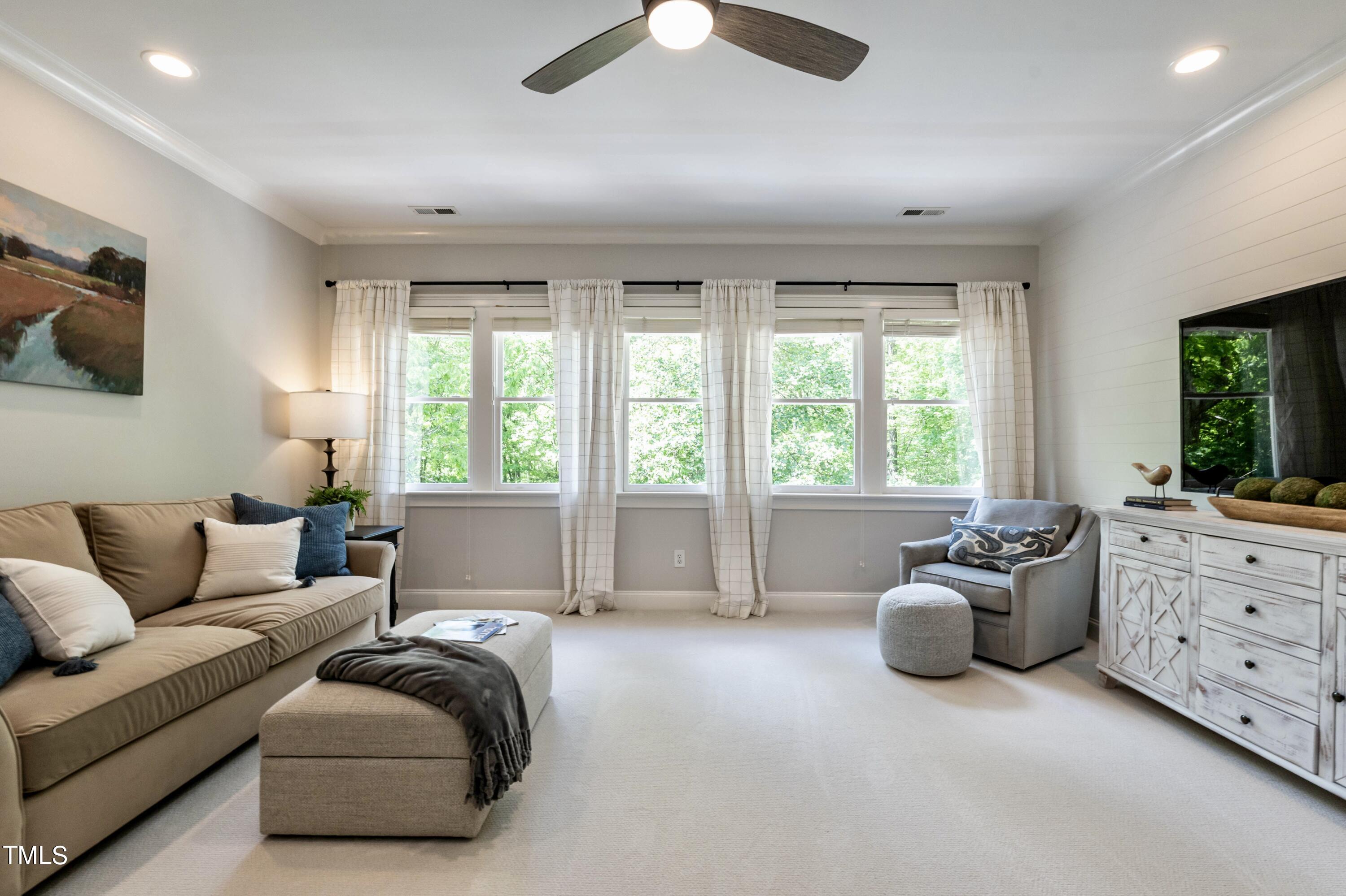7209 Sunset Glen Point Raleigh, NC 27614 - Photo 26 of 44 a living room with furniture and large windows