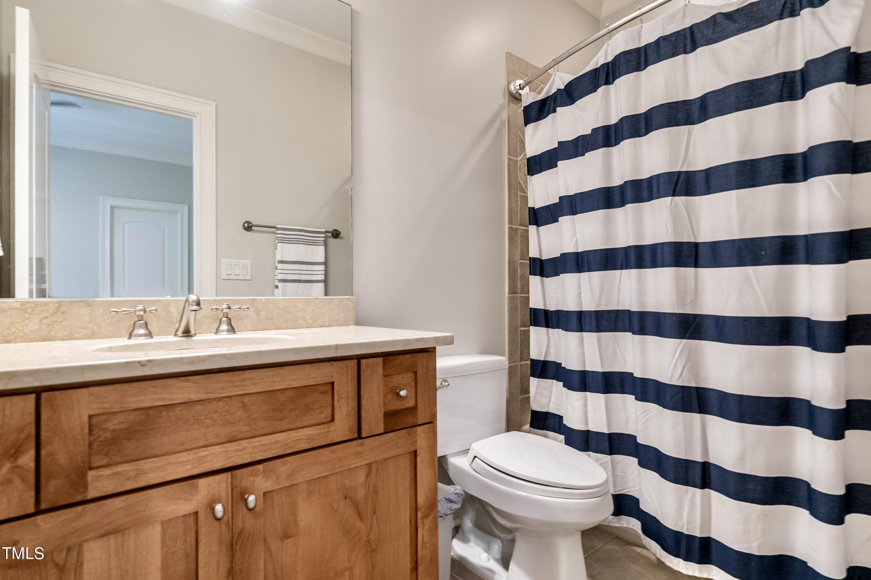 7209 Sunset Glen Point Raleigh, NC 27614 - Photo 29 of 44 a bathroom with a sink toilet and shower