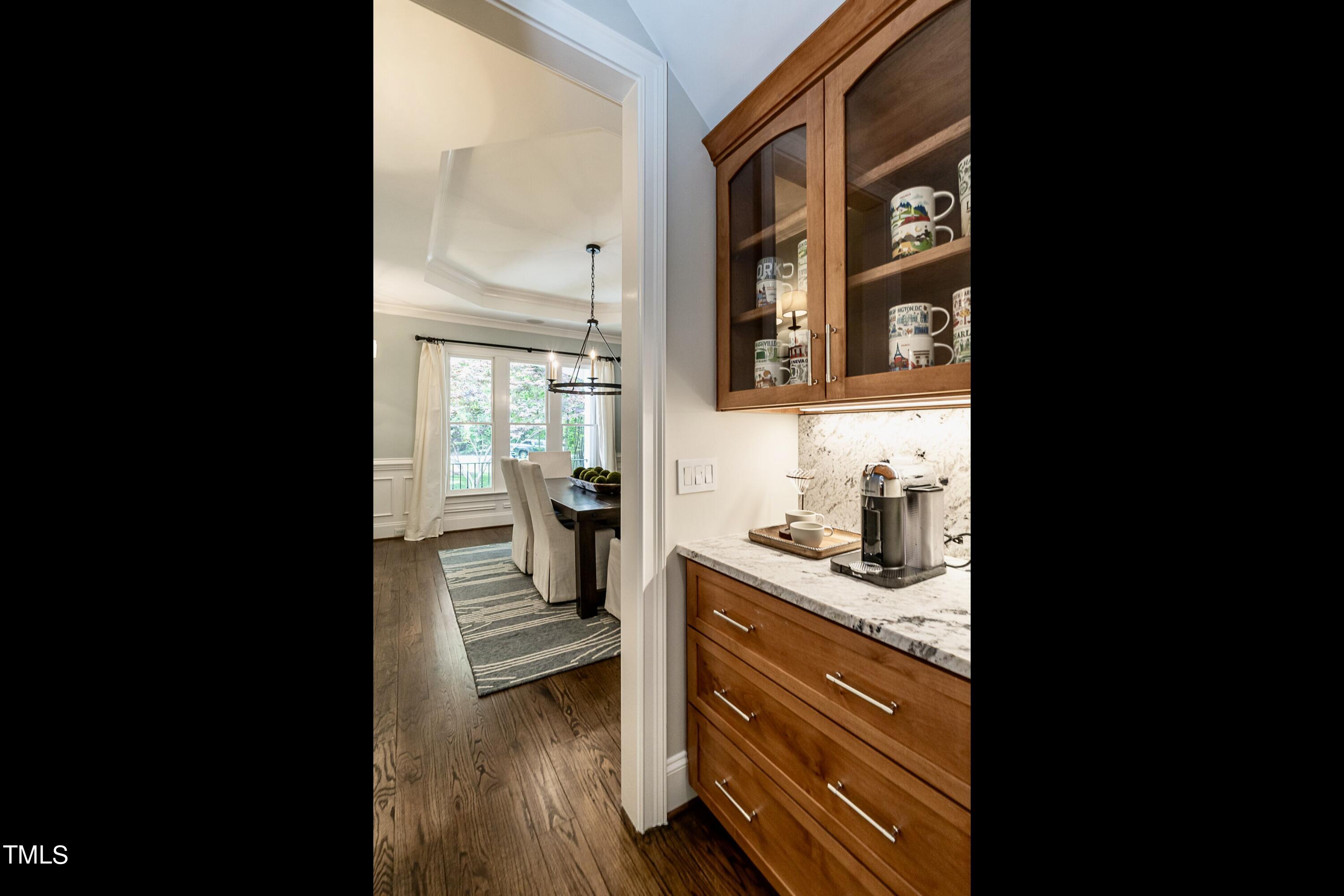 7209 Sunset Glen Point Raleigh, NC 27614 - Photo 7 of 44 a view of a kitchen from the hallway