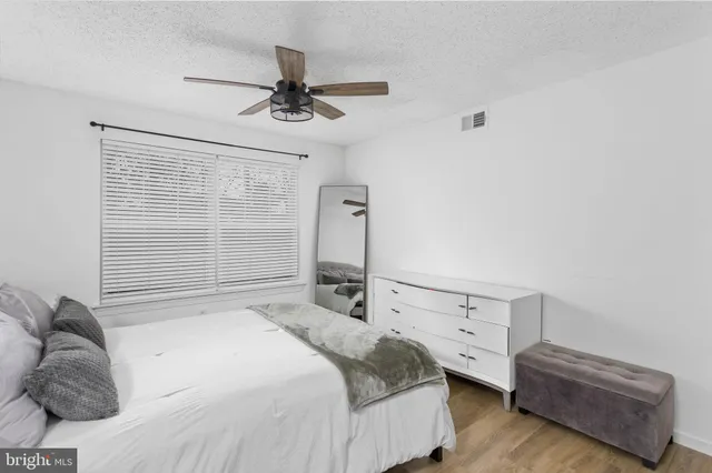 a bedroom with a bed and a cabinets