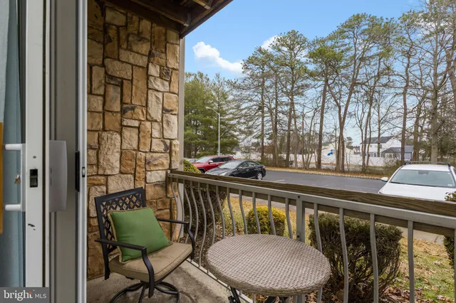 a view of a balcony with chairs
