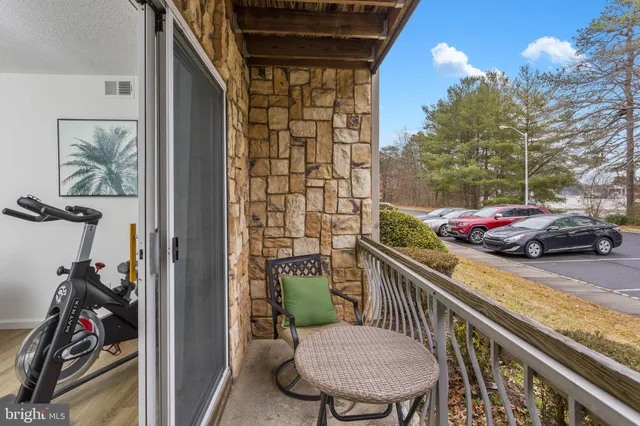 a view of a balcony with chairs