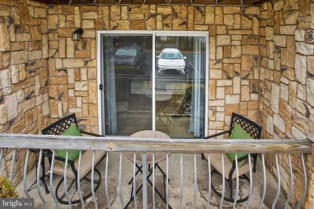 a view of a balcony with wooden floor