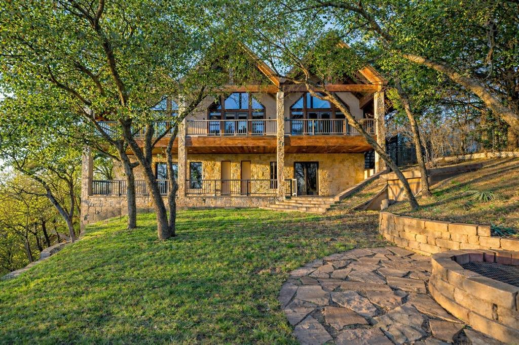 9930 Boat Club Road Fort Worth, TX 76179 - Photo 32 of 40 Hill Lodge is a warm and inviting guest house that offers a private gated entrance and its own fenced yard for added privacy and comfort.