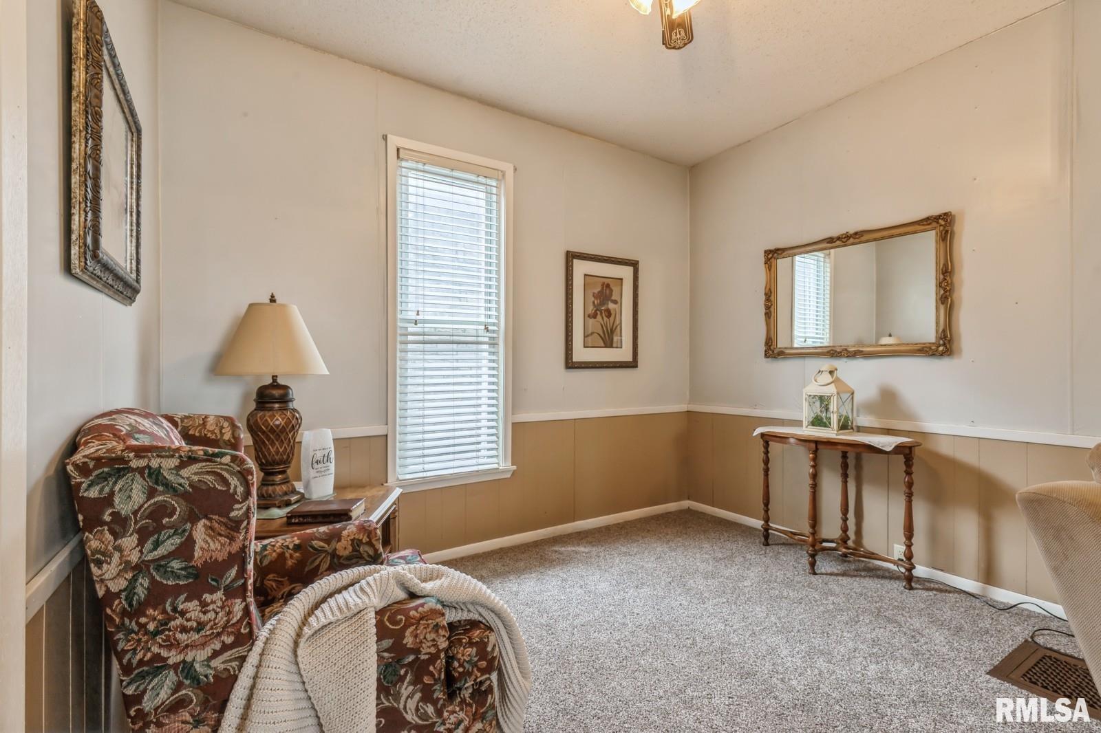 1301 Caroline Avenue Clinton, IA 52732 - Photo 11 of 19 a room with furniture and a window