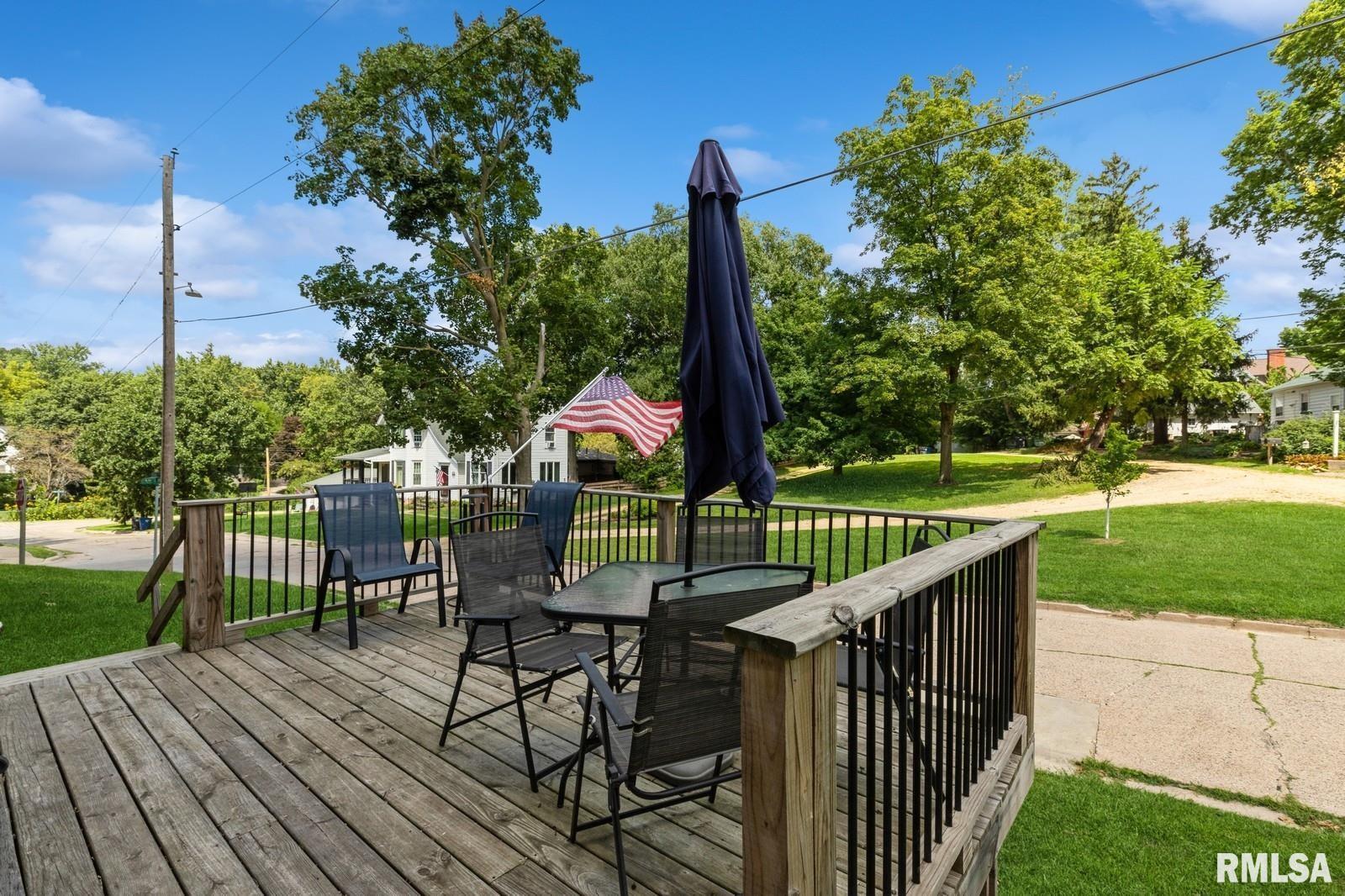 1301 Caroline Avenue Clinton, IA 52732 - Photo 4 of 19 a view of a deck with wooden floor and outdoor seating