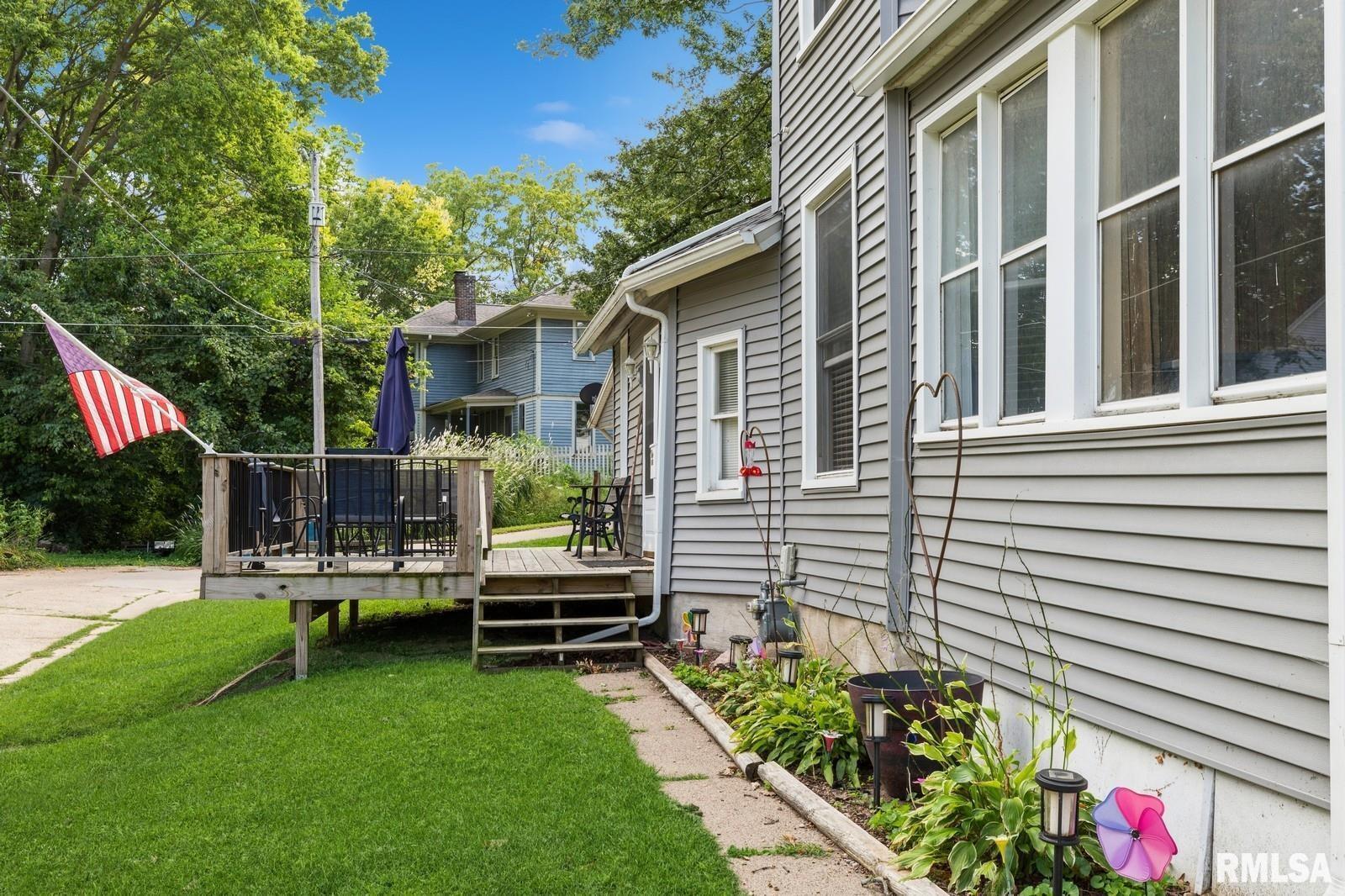 1301 Caroline Avenue Clinton, IA 52732 - Photo 5 of 19 a view of a chair and tables in the back yard of the house