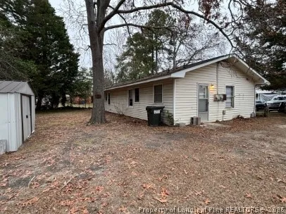 a view of a house with a yard and garage
